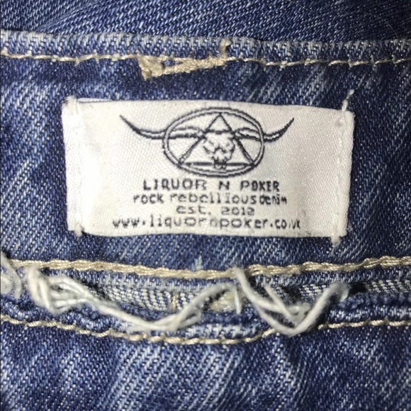 High rise side button embroidered mom jeans. - Picture 6 of 7